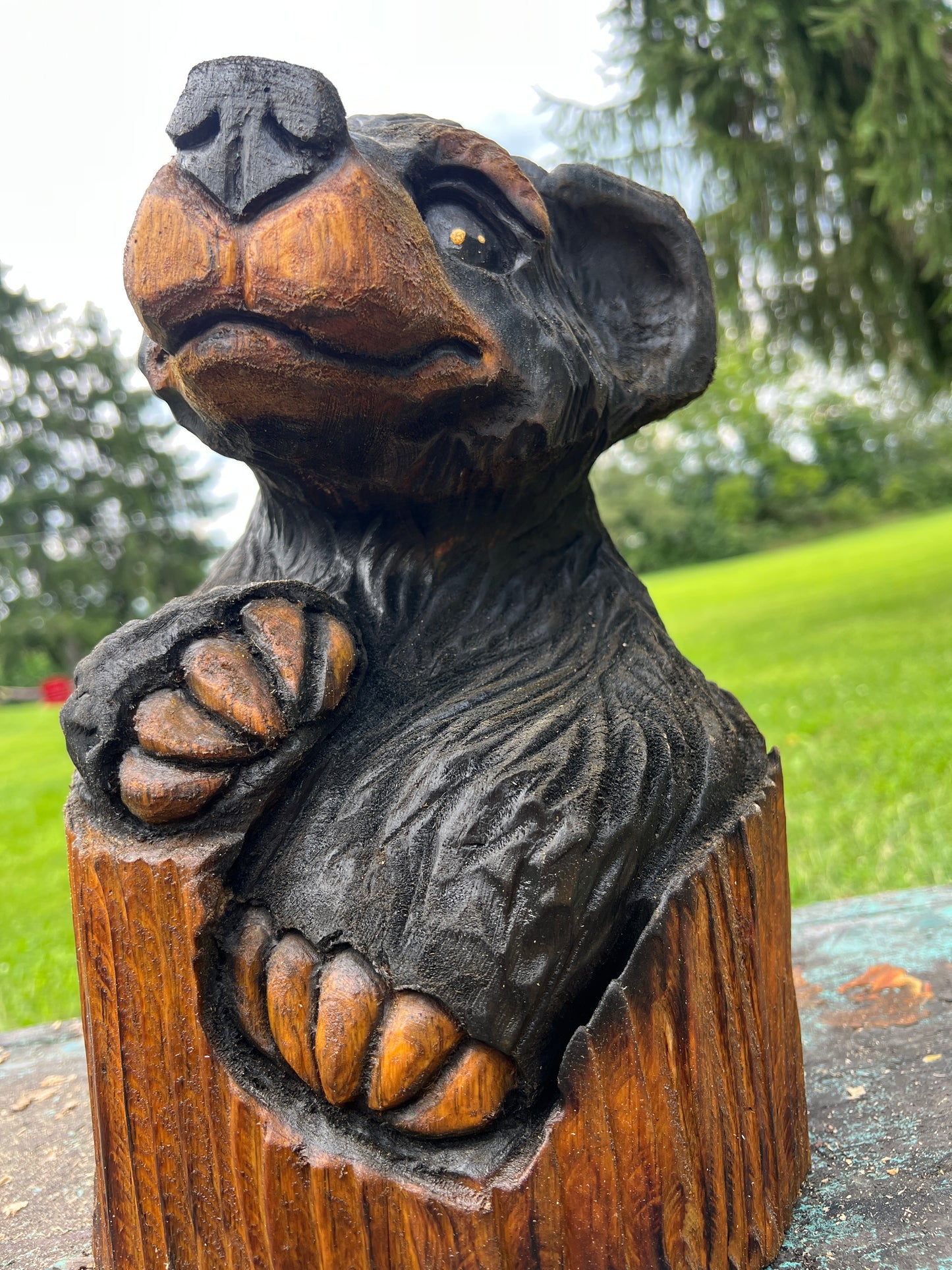 Hand-Carved Bear in Log