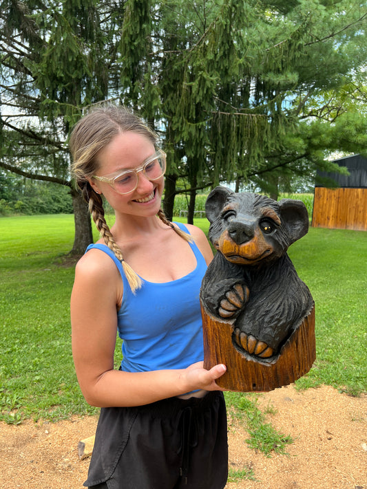 Hand-Carved Bear in Log