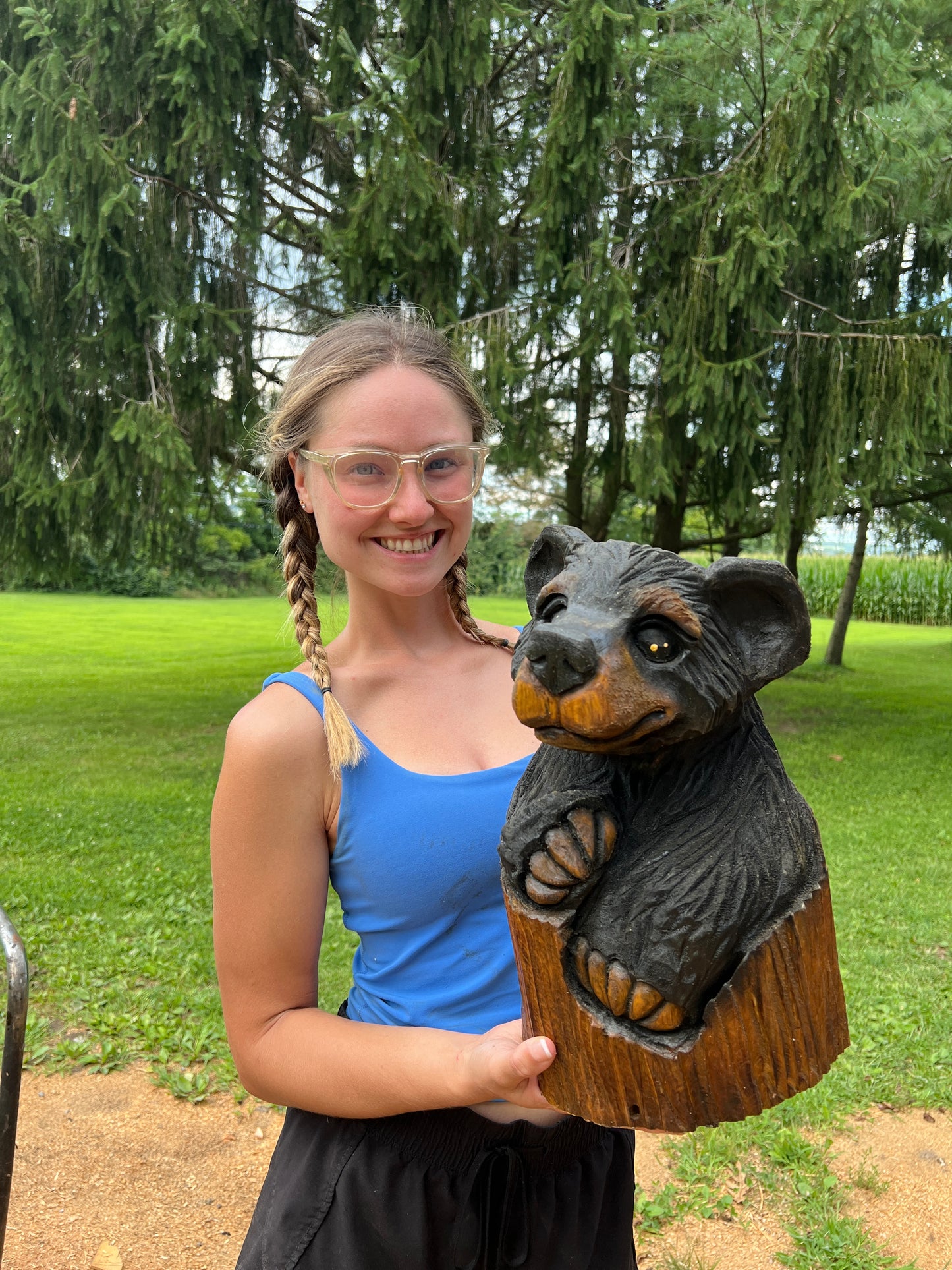 Hand-Carved Bear in Log