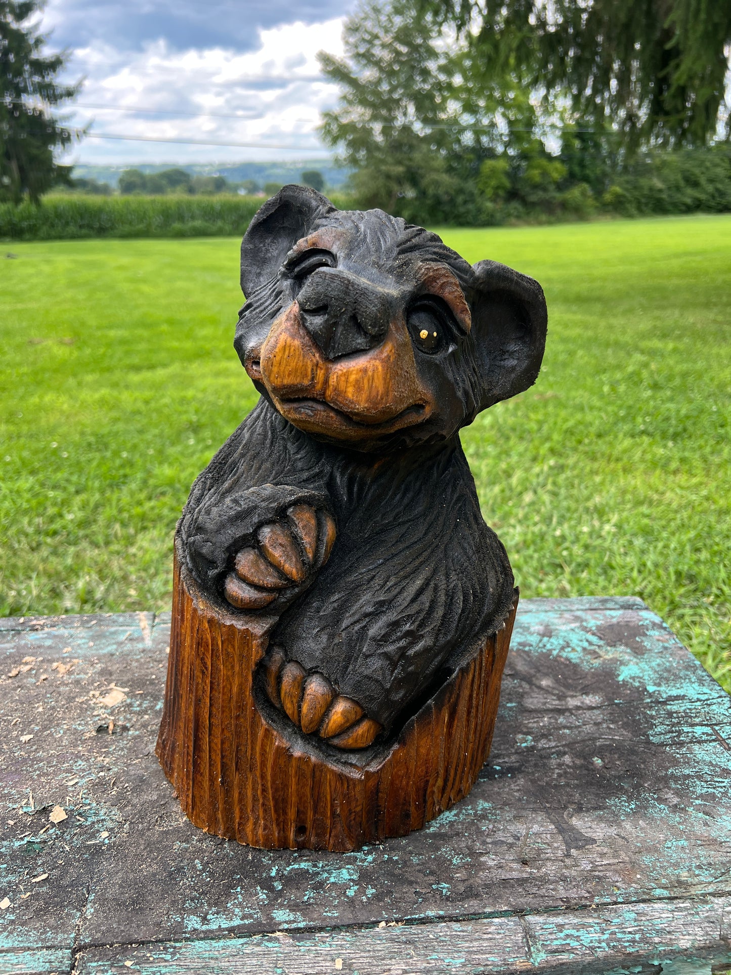 Hand-Carved Bear in Log