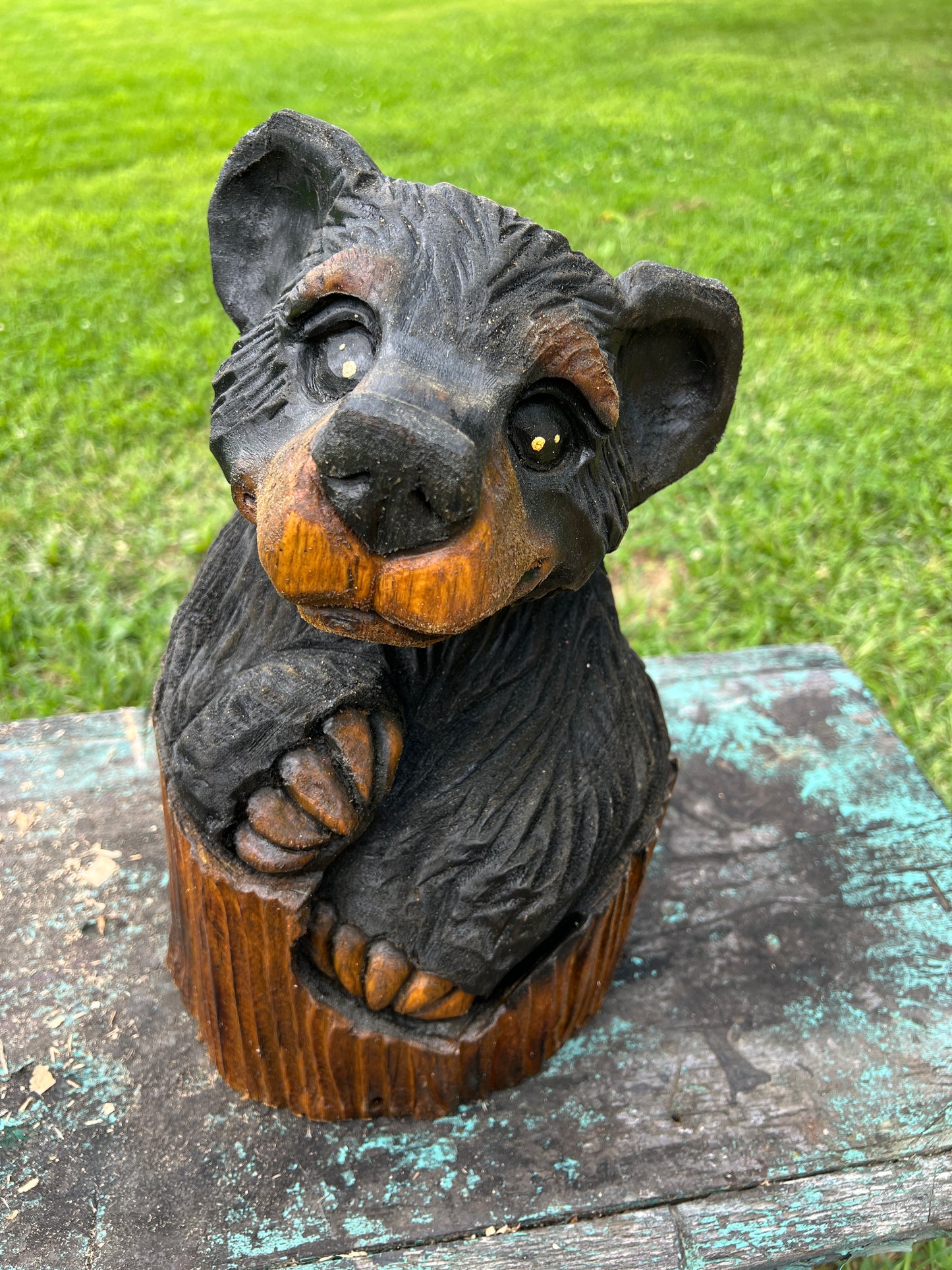 Hand-Carved Bear in Log
