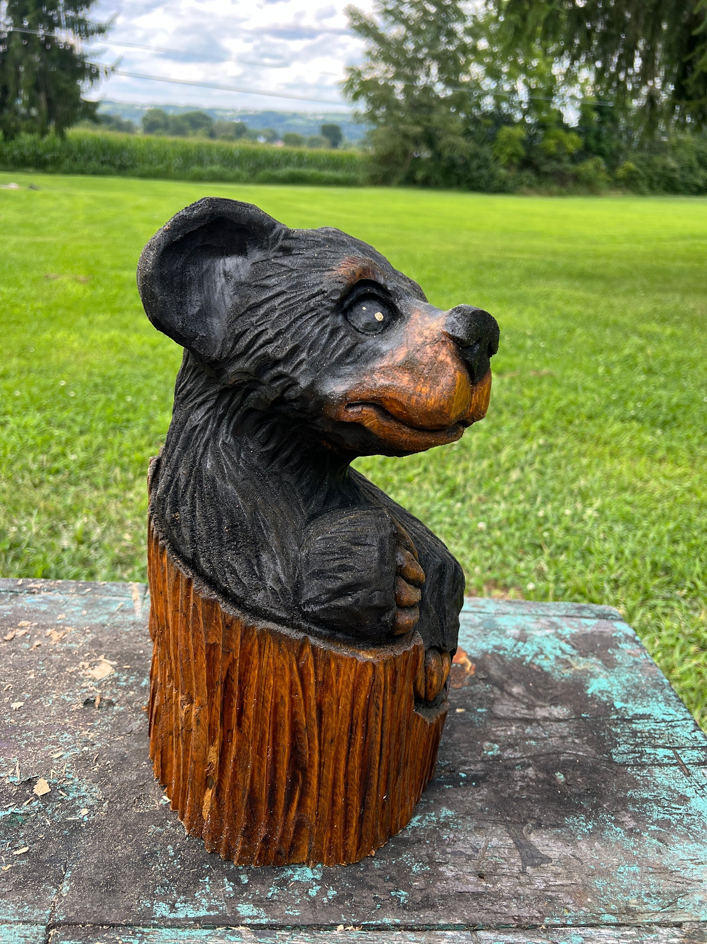 Hand-Carved Bear in Log