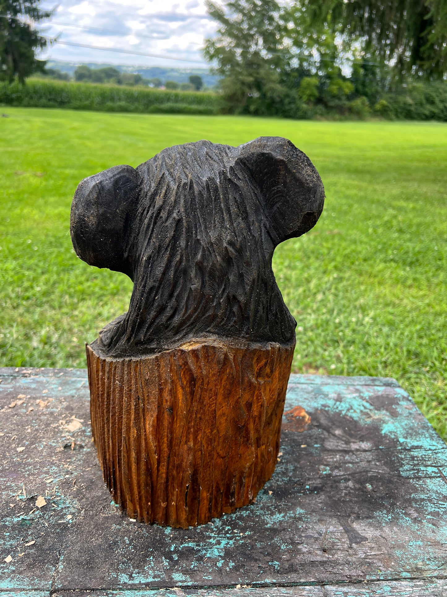 Hand-Carved Bear in Log