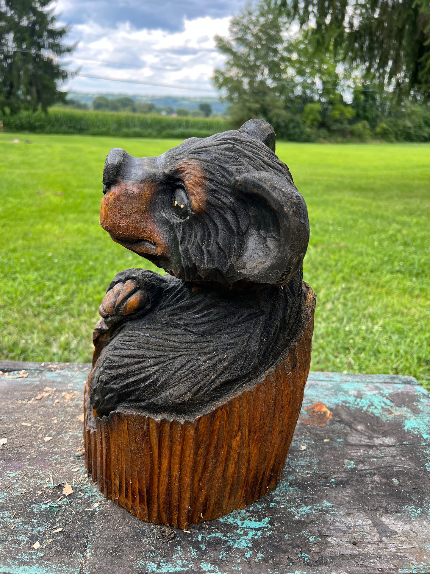 Hand-Carved Bear in Log